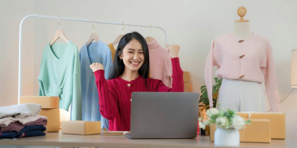 woman at laptop with clothing