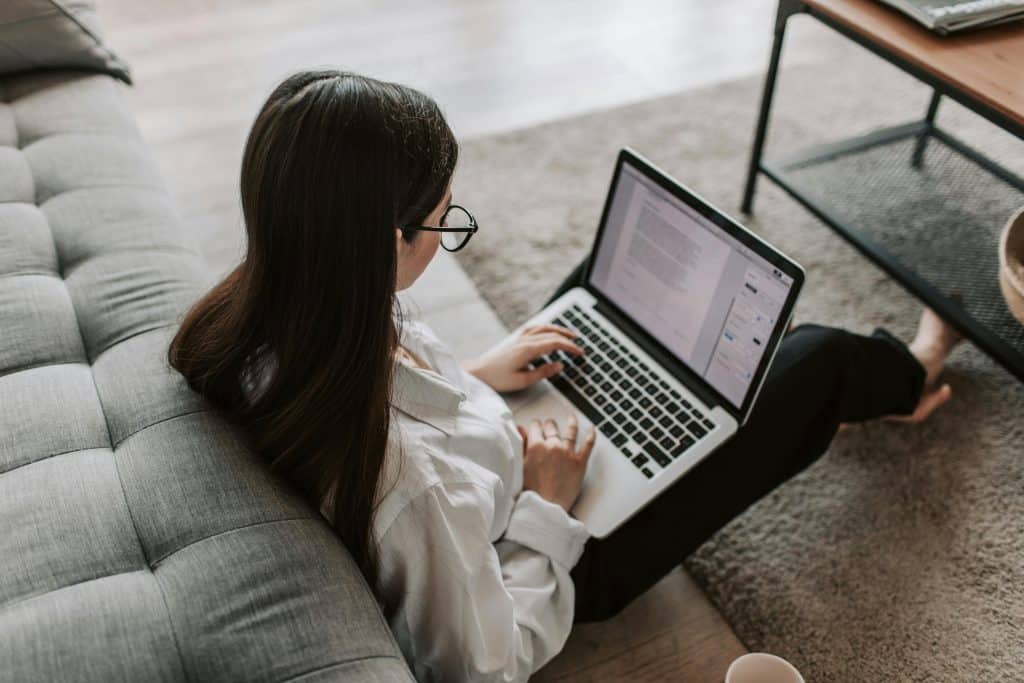 woman reading on laptop